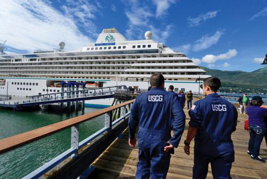 Members of Coast Guard Sector Juneau Inspections Division arrive at the cruise ship Crystal Serenity