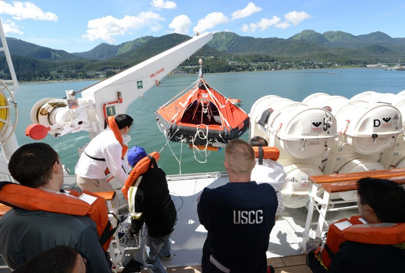 Lt. Ryan Butler observes crewmembers as they test the capabilities of a crane 