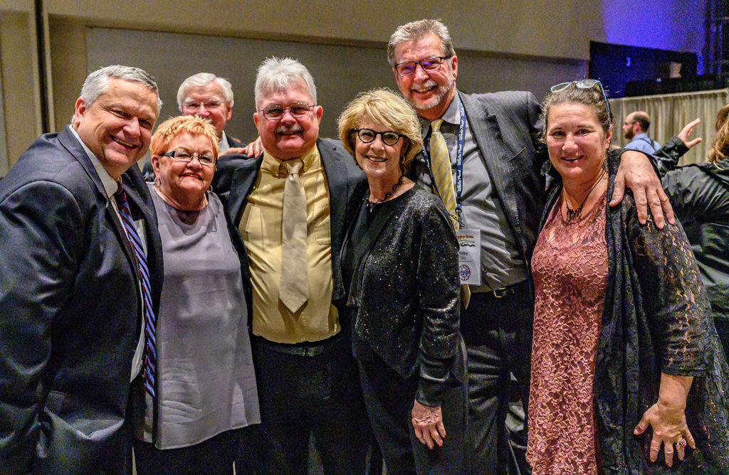 Dave Karp, Northern Air Cargo, Mary Pignalberi, Salmonberry Tours and Dennis Brandon, Brandon Marketing, pose with Lifetime Achievement award winner John Litten, Ginger Johnson, Special Recognition winner Kirby Day and Toni Walker, who accepted the Aurora Award for Katie Caswell of Logistics. ATIA/Frank Flavin